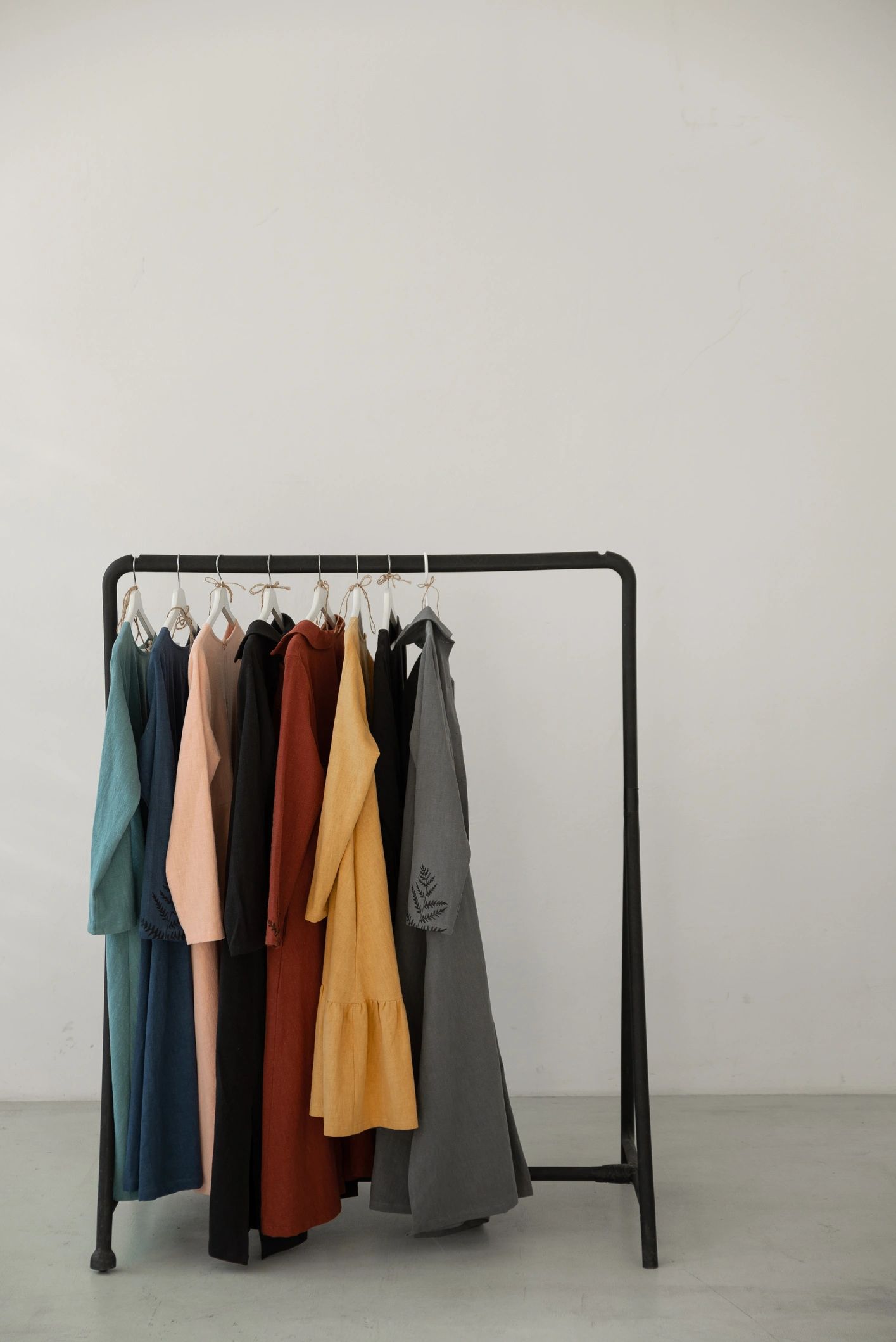 Minimal clothing rack with linen garments