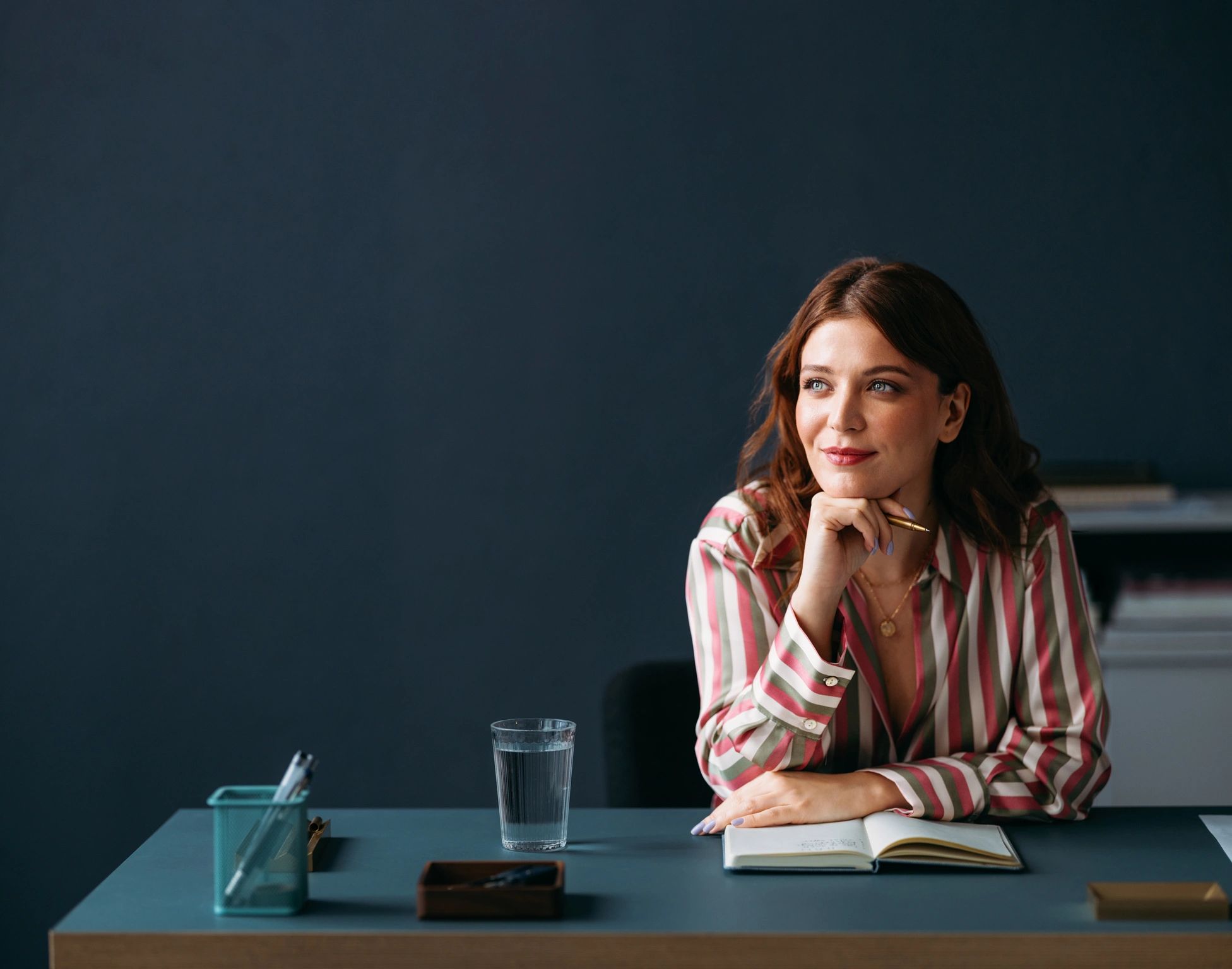 Woman at desk in a minimal workspace