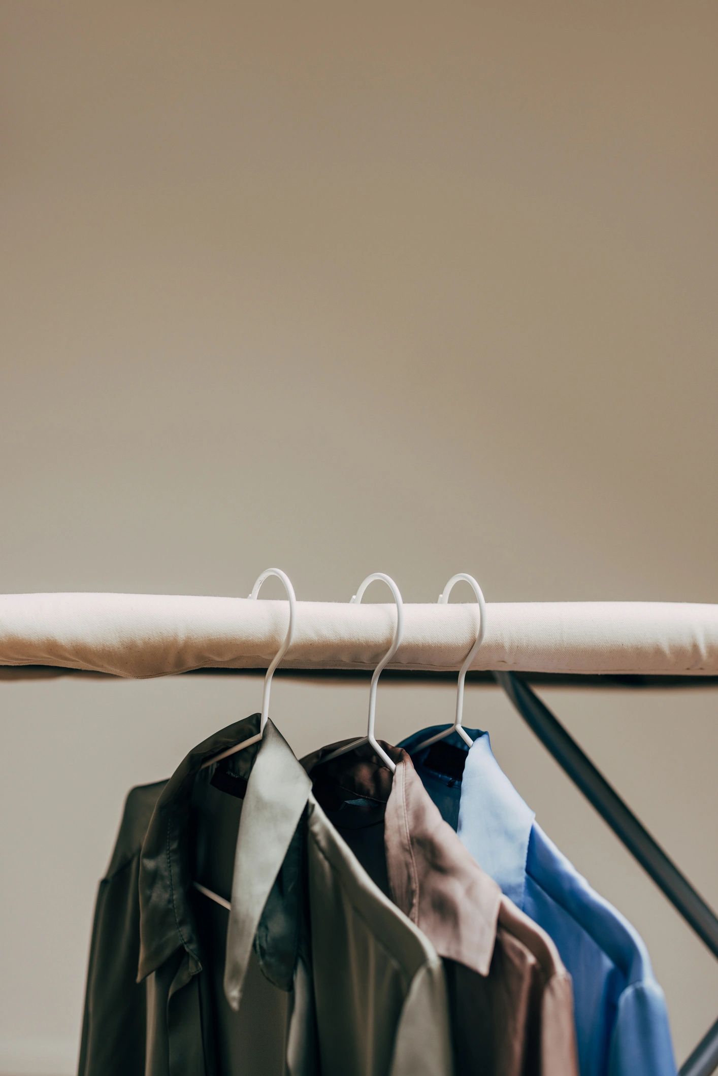 Assorted shirts neatly arranged on hangers