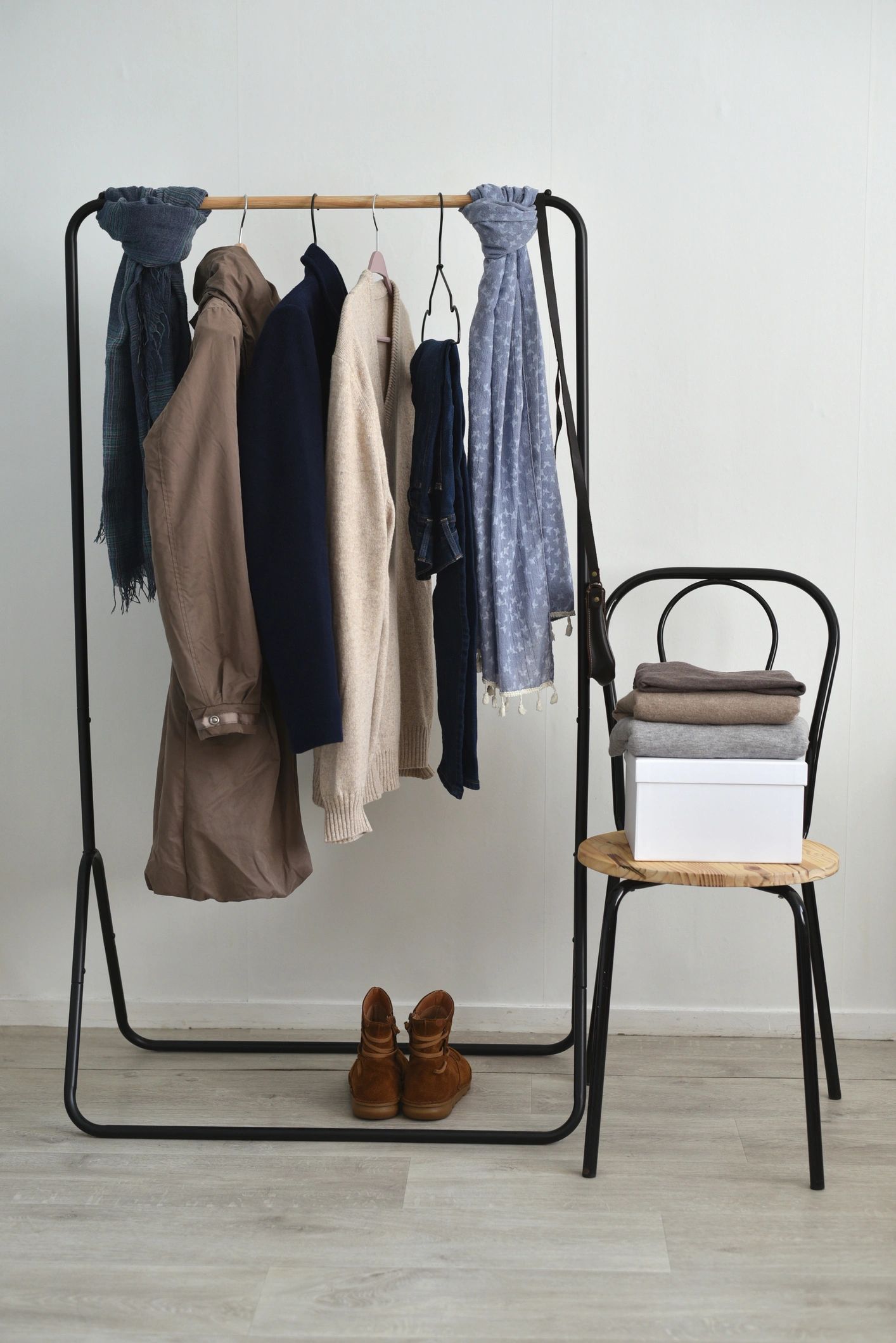 Neutral clothing rack in a minimal room